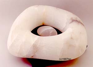 Needham alabaster sculpture solid within a ring